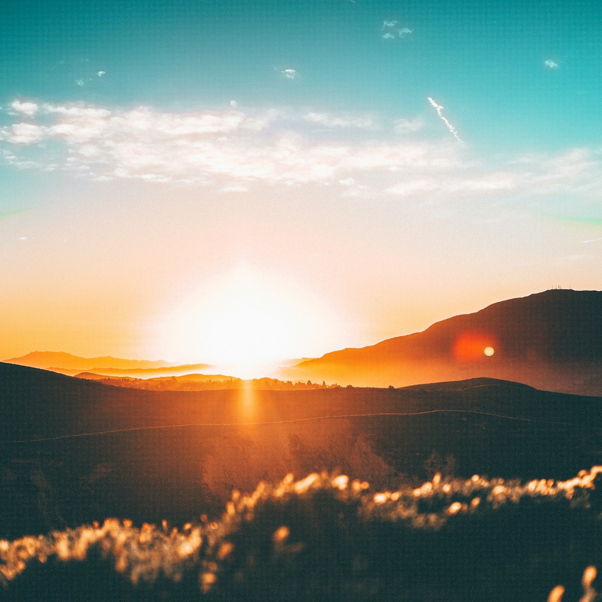 Bright sun over the horizon representing the Adityas